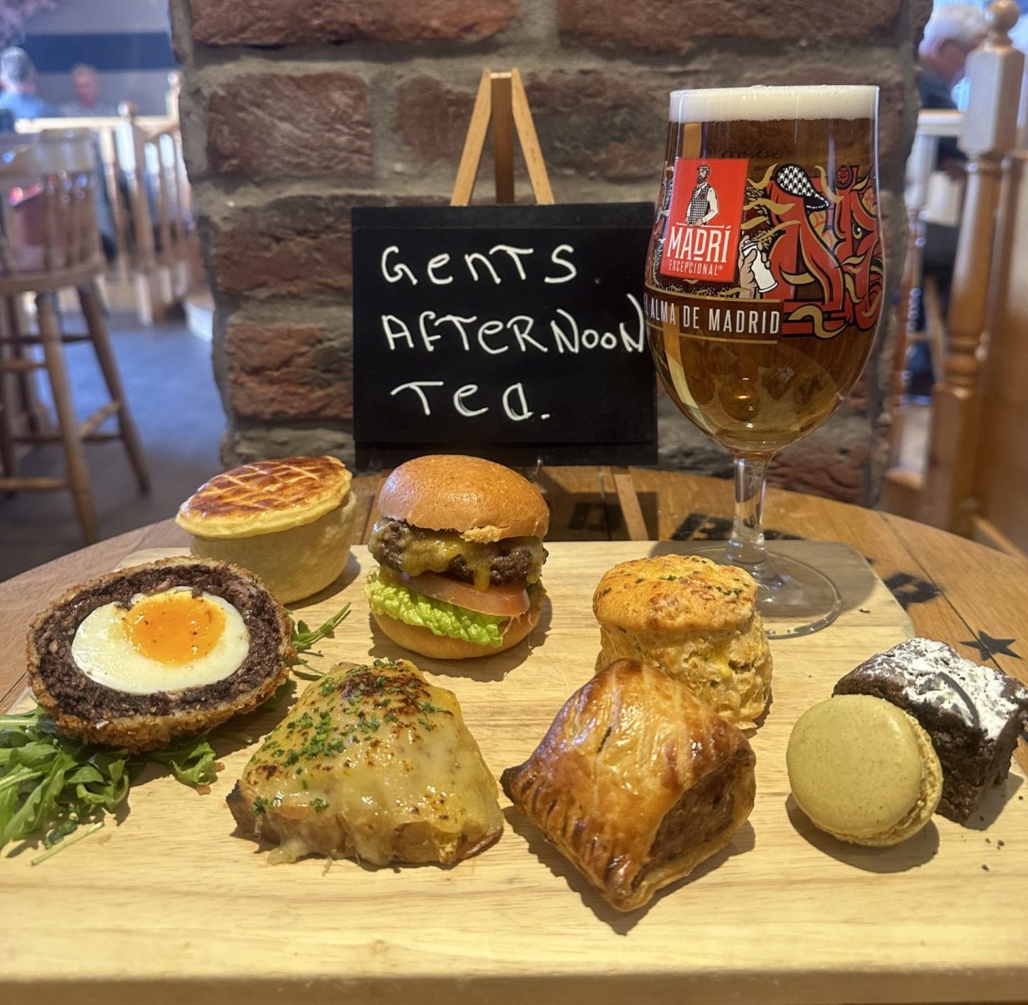 The gents afternoon tea on offer at the Burntisland Sands Hotel. It includes a burger, pastry, scone, huge Scotch egg, pie, macaron, brownie and a pint.