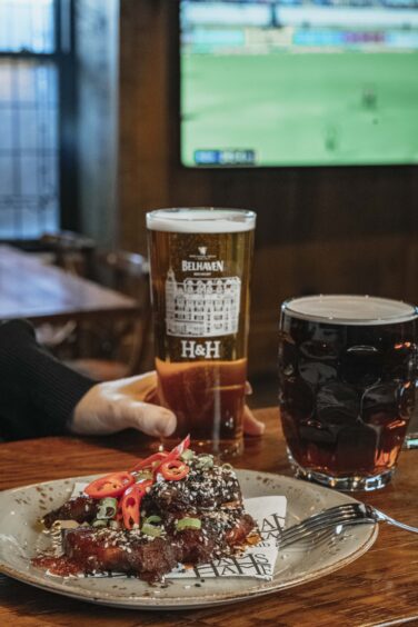 A plate of hot wings and a pint of Belhaven lager at Hams Hame in St Andrews.