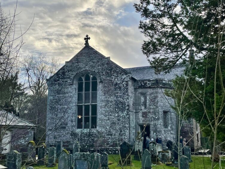 St Martins church exterior with grave outside