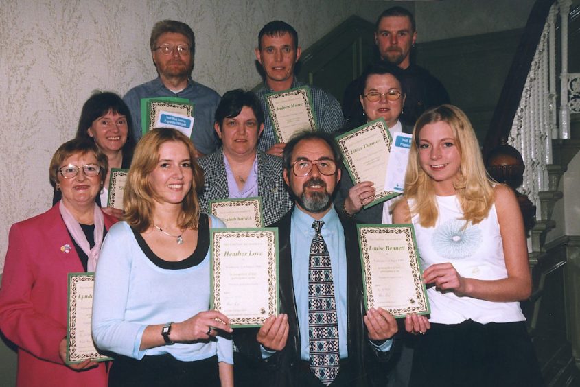 Councillor John Hendry presents certificates to the successful youth workers