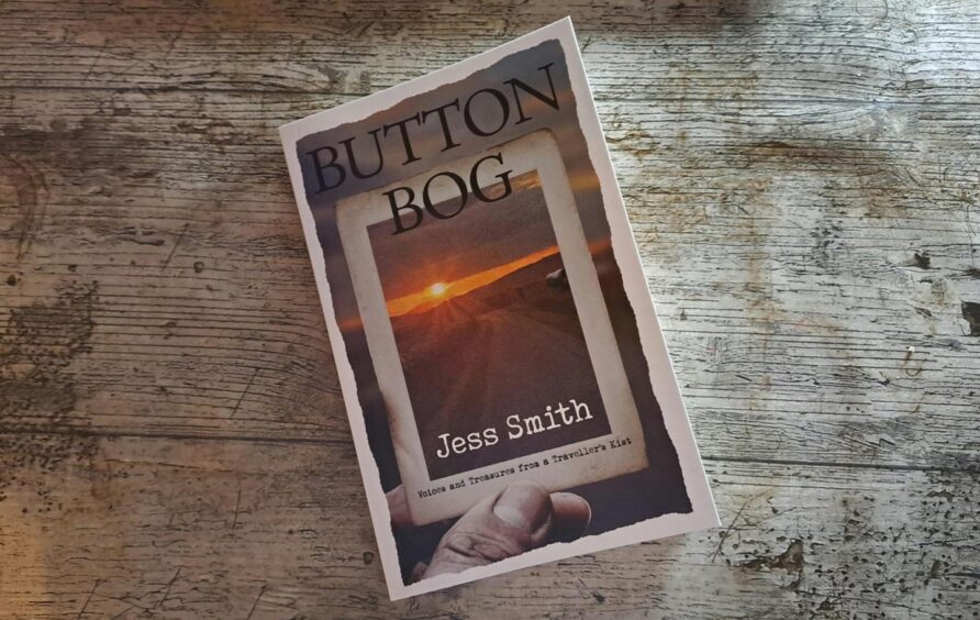 Button Bog book on wooden table