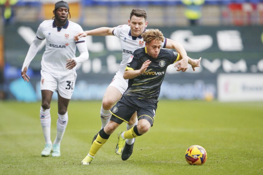 Stephen Duke-McKenna goes past a Tranmere Rovers defender.