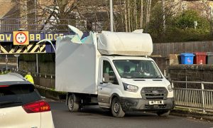 The roof of the van has been ripped off after hitting the bridge on St Vincent Street. Image: Ben MacDonald/DC Thomson