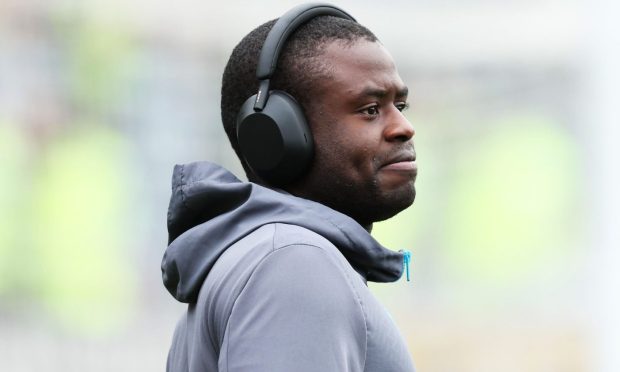 Benji Kimpioka with headphones on before a St Johnstone game.