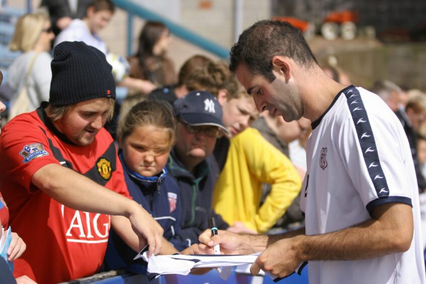 Gary Harkins, who was a popular figure, signs for fans