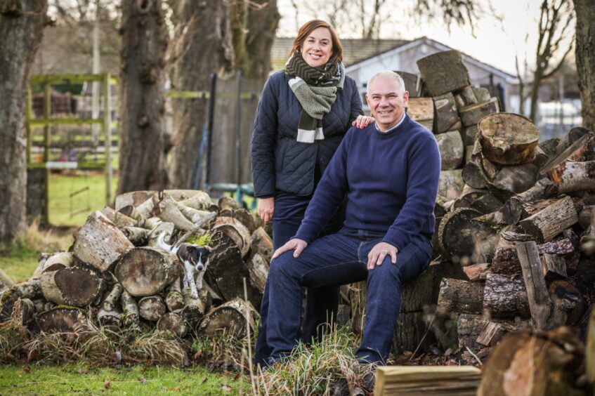 Graeme with his wife Lynne and pooch Pip at home in Monifieth. 