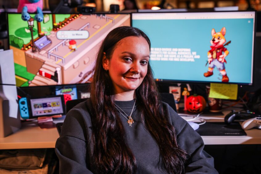 Hannah at her desk