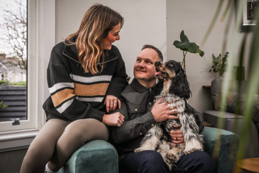 Kirsty, who was diagnosed with a rare abdominal cancer last year, with her partner Neil at home in Broughty Ferry. 