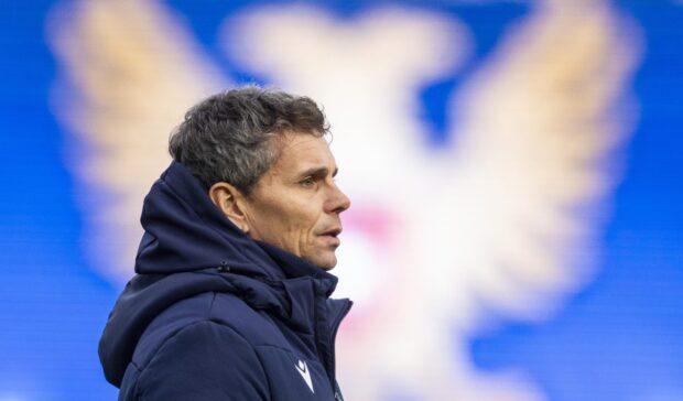 A close-up picture of Simo Valakari in front of the St Johnstone club crest.