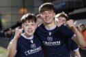 Captain Josh Mitchell (left) and goal scorer Mikey Hunter celebrate after Dundee U/18s' victory. Image: David Young