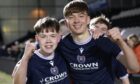 Captain Josh Mitchell (left) and goal scorer Mikey Hunter celebrate after Dundee U/18s' victory. Image: David Young