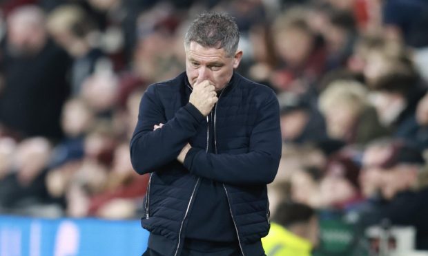 Dundee manager Tony Docherty, deep in thought at Tynecastle. Image: David Young/Shutterstock