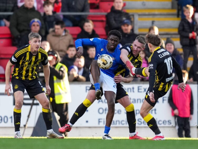 Benji Kimpioka with three Aberdeen players for company. 