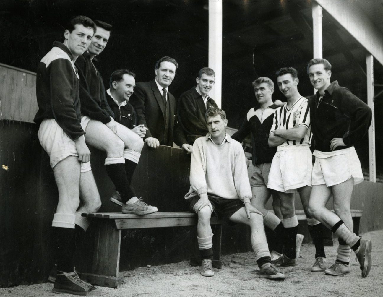 Jock Stein and his players in April 1961, posing for a picture by the side of the pitch. 