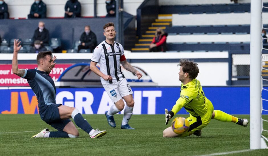 Lewis Vaughan slides in to score for Raith Rovers against Dunfermline Athletic.