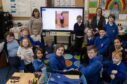 Friends of Toowa trustee Rhona Guild (left) with Aberlemno pupils and teacher Jill Brown. Image: Paul Reid