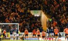 Dundee United fans celebrate Vicko Sevelj's equaliser at Dens Park. Image: SNS