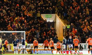 Dundee United fans celebrate Vicko Sevelj's equaliser at Dens Park. Image: SNS