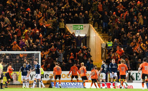 Dundee United fans celebrate Vicko Sevelj's equaliser at Dens Park. Image: SNS