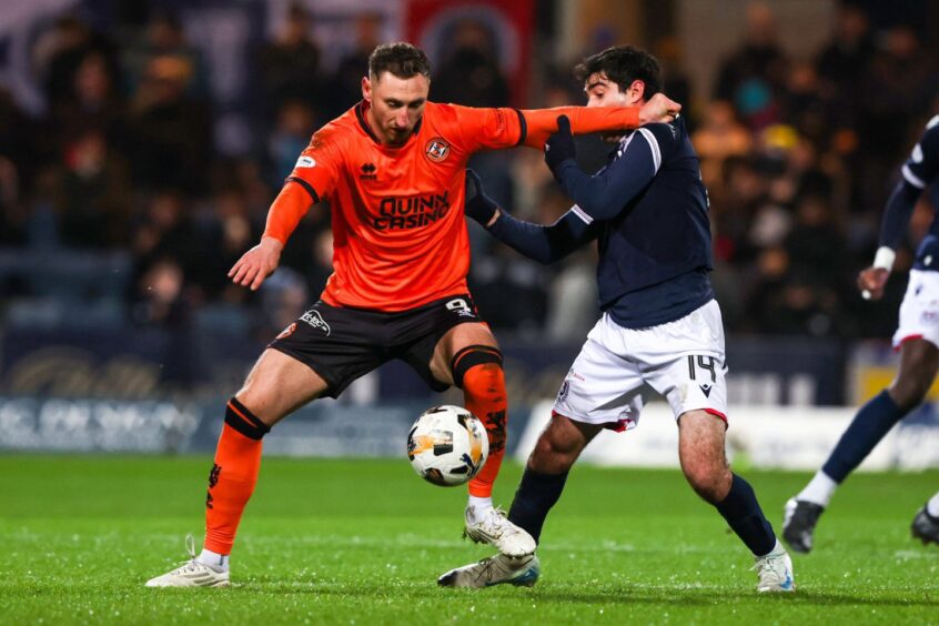 Garza and Dundee United striker Louis Moult clash at Dens Park. Image: Craig Williamson/SNS