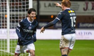 Cesar Garza celebrates after a Dundee derby win