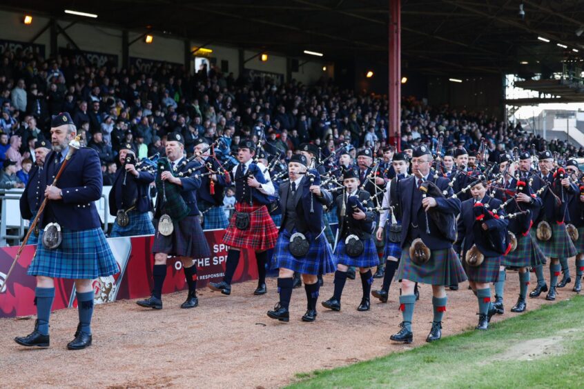 The pipe band at Dens Park. Image: Roddy Scott/SNS