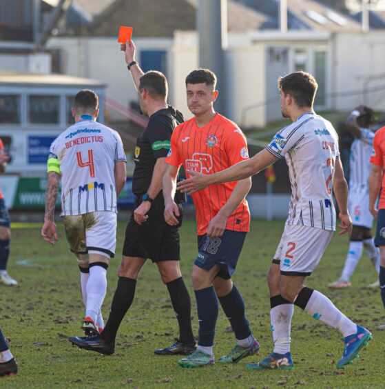 Kyle Benedictus is shown the red card. 