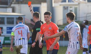 Dunfermline Athletic FC skipper Kyle Benedictus is shown the red card.