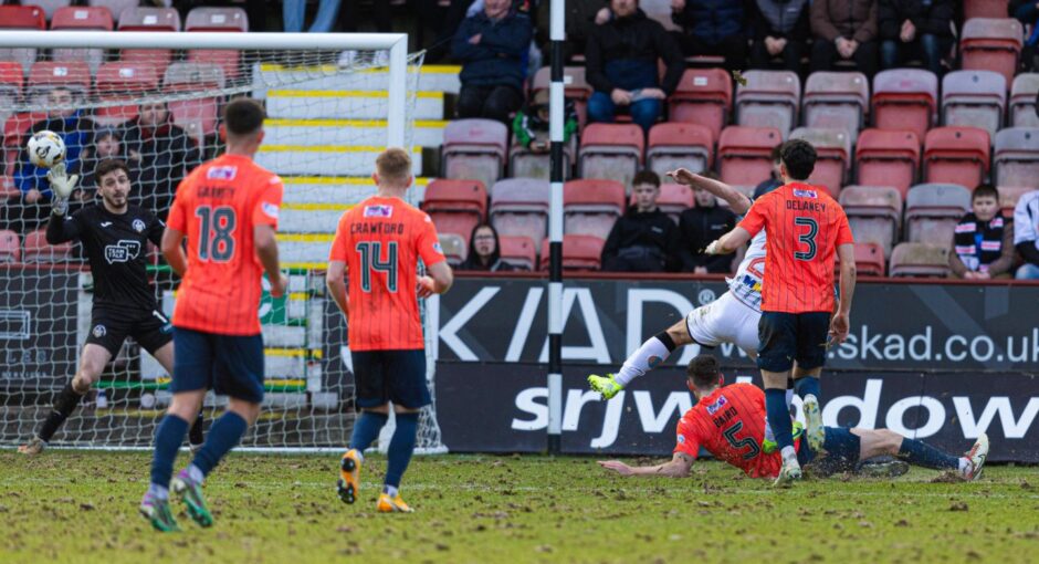 Chris Kane smashes in Dunfermline's winning goal. 