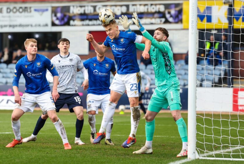 Sven Sprangler heads a ball clear. 