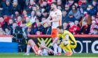 Declan Gallagher is an injury concern for Dundee United after the weekend's draw with Aberdeen. Image: SNS