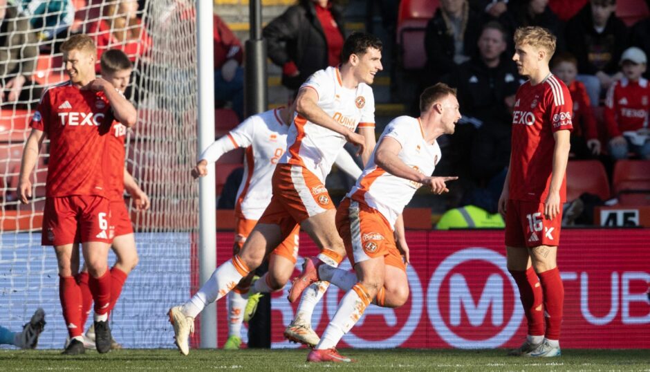 Dundee United stars celebrate Sam Dalby's 13th goal of the season.