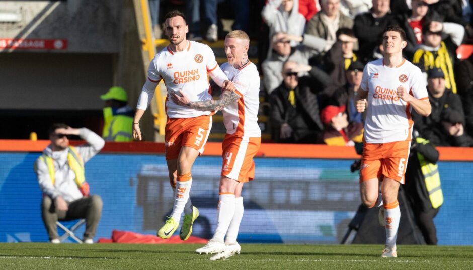 Craig Sibbald celebrates with Vicko Sevelj.