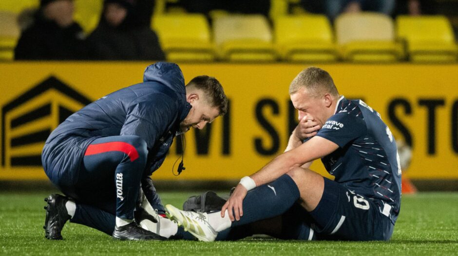 Raith Rovers skipper Scott Brown receives treatment after going down early in the draw with Livingston.