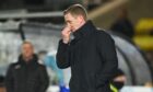 Raith Rovers manager Barry Robson pinches his nose.