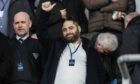 Dunfermline Athletic owner James Bord gives the thumbs up with chairman and CEO David Cook to his right.
