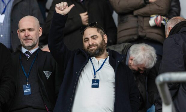 Dunfermline Athletic owner James Bord gives the thumbs up with chairman and CEO David Cook to his right.