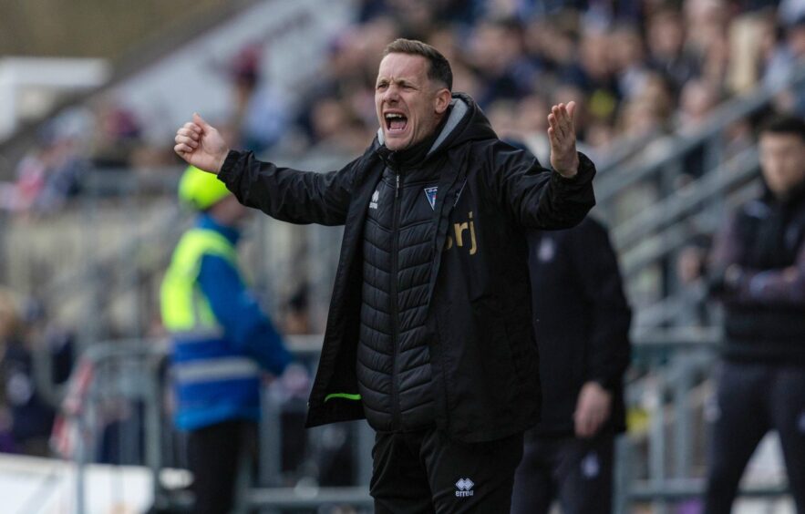 Dunfermline head coach Michael Tidser shouts from the sidelines.