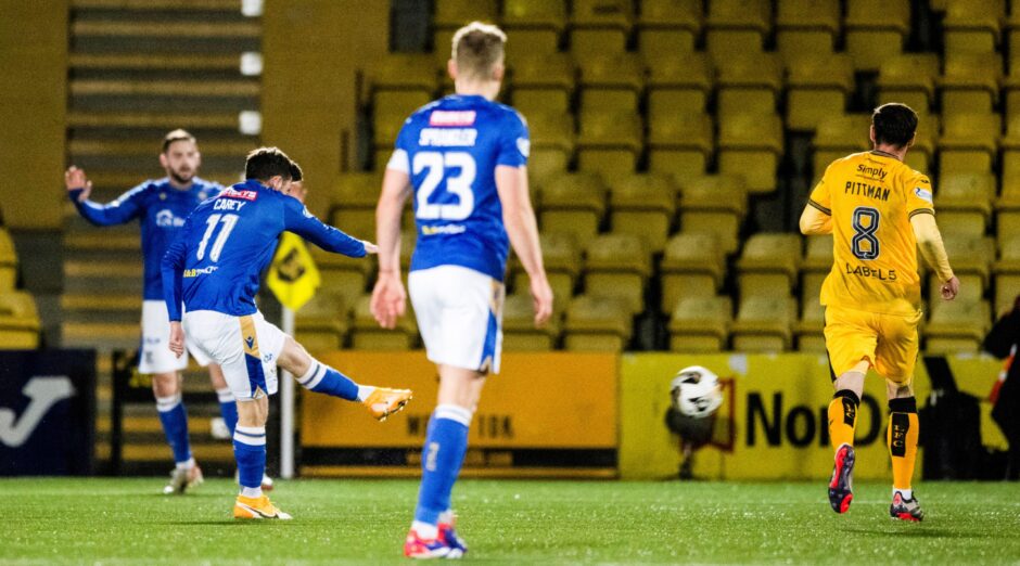 Graham Carey smashes home his 30-yard goal.