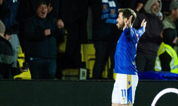 St Johnstone's Graham Carey celebrates scoring his spectacular winner.