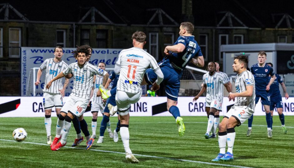 Paul Hanlon knocks in Raith Rovers' second goal against Dunfermline in a crowded penalty box.