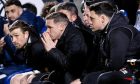 Dunfermline Athletic head coach Michael Tidser holds his hands to his face.