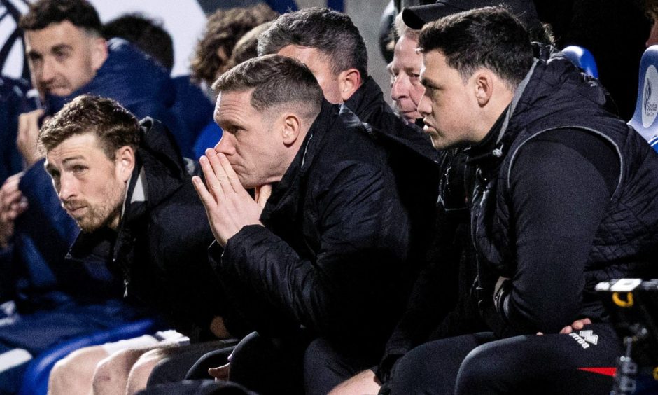 Ex-Dunfermline Athletic head coach Michael Tidser holds his hands to his face.