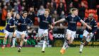 Dundee celebrate their remarkable derby win at Dundee United. Image: Ross Parker/SNS