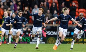 Dundee celebrate their remarkable derby win at Dundee United. Image: Ross Parker/SNS