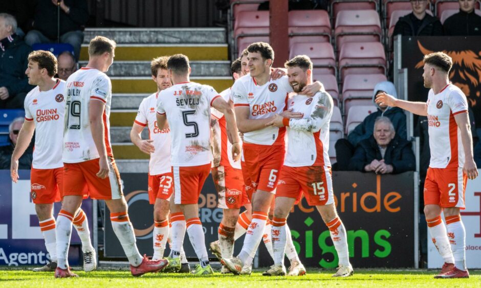 The Dundee United players celebrate