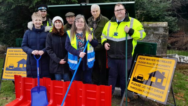 Group of people at sandbag station in Perth