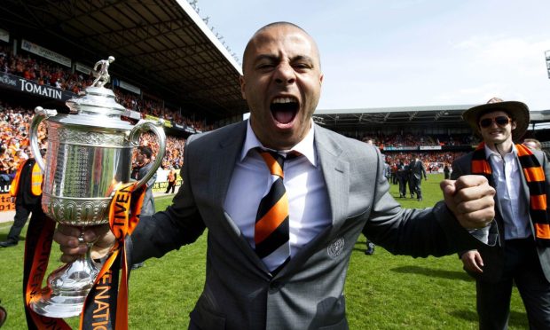 Danny Cadamarteri roars with delight with the Scottish Cup