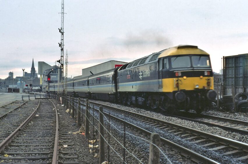 47702 Glasgow-Aberdeen train passing by in March 1985