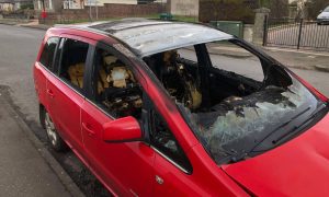 The fire-damaged car on Americanmuir Road in Dundee. Image: James Simpson/DC Thomson